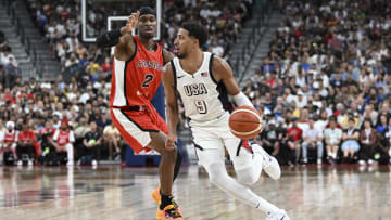 Jul 10, 2024; Las Vegas, Nevada, USA; USA guard Tyrese Haliburton (9) dribbles past Canada guard Shai Gilgeous-Alexander (2) in the second quarter in the USA Basketball Showcase at T-Mobile Arena. Mandatory Credit: Candice Ward-USA TODAY Sports