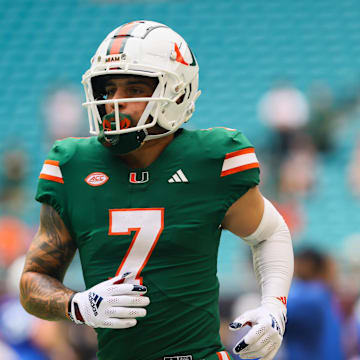 Nov 2, 2024; Miami Gardens, Florida, USA; Miami Hurricanes wide receiver Xavier Restrepo (7) runs on the field before the game against the Duke Blue Devils at Hard Rock Stadium. Mandatory Credit: Sam Navarro-Imagn Images