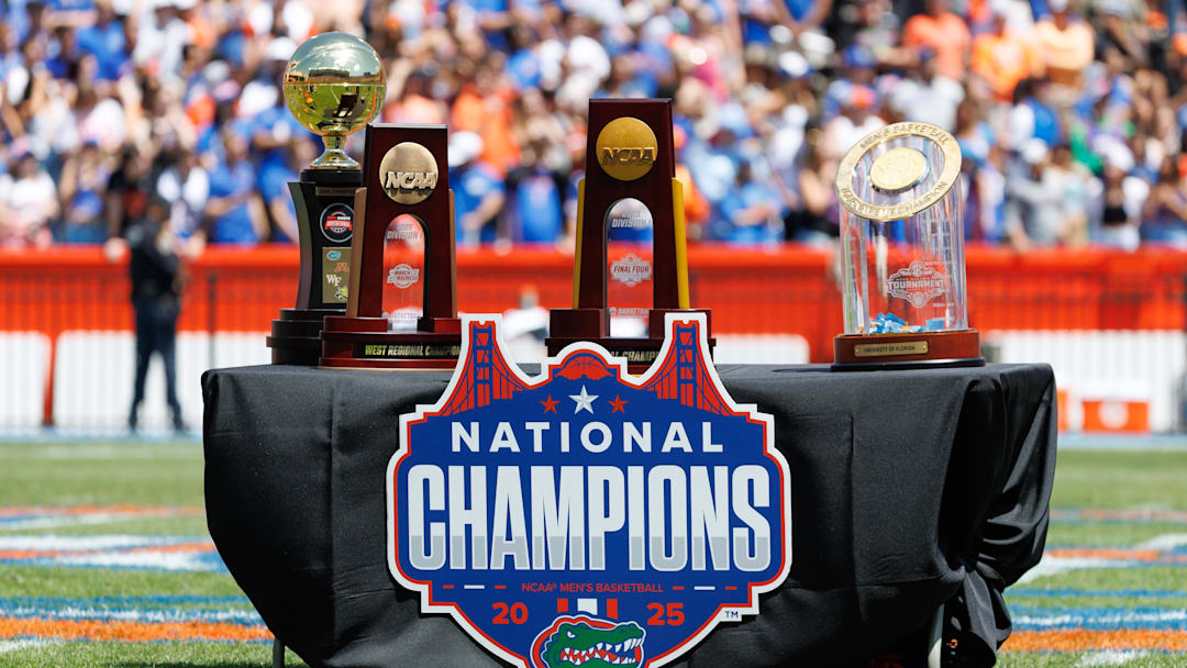 Apr 12, 2025; Gainesville, FL, USA; The trophys next to a banner during the National Championship celebration at Ben Hill Griffin Stadium. Mandatory Credit: Matt Pendleton-Imagn Images