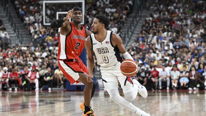 Jul 10, 2024; Las Vegas, Nevada, USA; USA guard Tyrese Haliburton (9) dribbles past Canada guard Shai Gilgeous-Alexander (2) in the second quarter in the USA Basketball Showcase at T-Mobile Arena. Mandatory Credit: Candice Ward-USA TODAY Sports