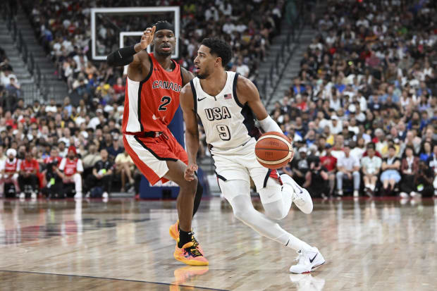 USA guard Tyrese Haliburton dribbles to the basket.