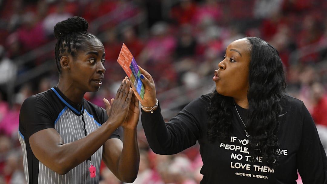 Feb 22, 2026; Louisville, Kentucky, USA;  Virginia Cavaliers head coach Amaka Agugua-Hamilton discuses a call with an official during the second half against the Louisville Cardinals at KFC Yum! Center. Mandatory Credit: Jamie Rhodes-Imagn Images