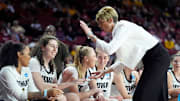 Iowa head women's basketball coach Jan Jensen congratulates players during second half of the first round of the NCAA Women's college basketball game between Iowa and Murray State at the Lloyd Noble Center in Norman, Okla., Saturday, March, 22, 2025.