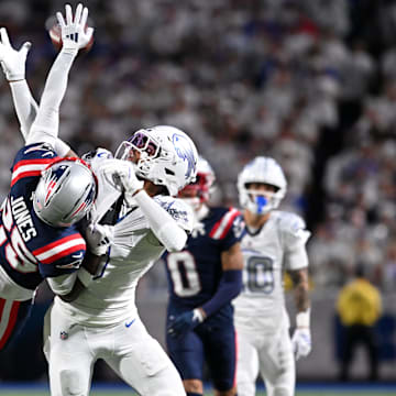 Oct 5, 2025; Orchard Park, New York, USA; New England Patriots cornerback Marcus Jones (25) tips the ball away from Buffalo Bills wide receiver Keon Coleman (0)