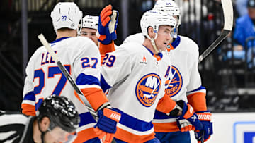 Jan 11, 2025; Salt Lake City, Utah, USA; New York Islanders center Brock Nelson (29) celebrates with left wing Anders Lee (27), defenseman Scott Mayfield (24), and center Mathew Barzal (13) after a goal against the Utah Hockey Club during third period at the Delta Center. Mandatory Credit: Christopher Creveling-Imagn Images