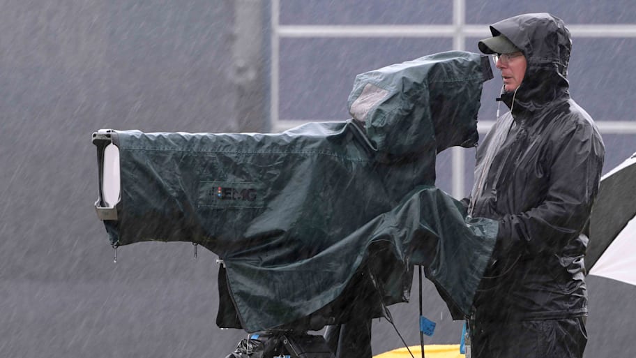 A camera operator persevered at the 2024 British Open at Royal Troon so viewers could watch rainy golf from their couches. | Ross Kinnaird/Getty Images