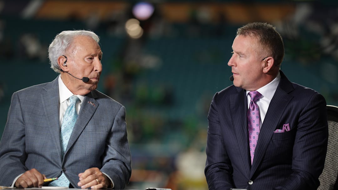 Jan 9, 2025; Miami, FL, USA; ESPN analysts Lee Corso and Kirk Herbstreit before the game between the Notre Dame Fighting Irish and the Penn State Nittany Lions in the Orange Bowl at Hard Rock Stadium. Mandatory Credit: Nathan Ray Seebeck-Imagn Images