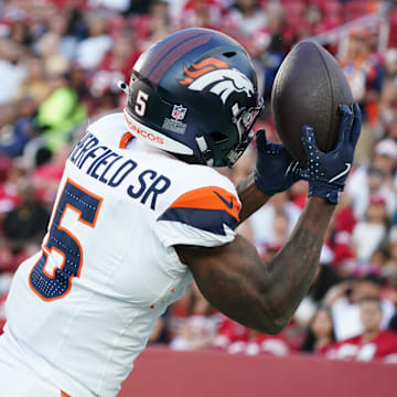 Aug 9, 2025; Santa Clara, California, USA;  Denver Broncos wide receiver Trent Sherfield Sr. (5) makes a touchdown catch over San Francisco 49ers cornerback Dallis Flowers (35) in the second quarter at Levi's Stadium. 