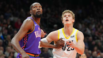 Jan 11, 2025; Phoenix, Arizona, USA; Utah Jazz forward Lauri Markkanen (23) and Phoenix Suns forward Kevin Durant (35) battle for position during the first half at Footprint Center. Mandatory Credit: Joe Camporeale-Imagn Images