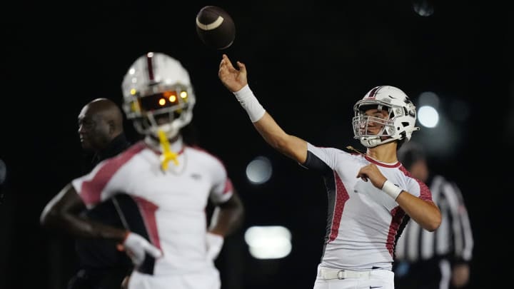 Quarterback Caleb Butler of Palm Beach Central warms-up before the 4M region final game against Monarch at Coconut Creek High School in Coconut Creek, Florida, Nov. 24, 2023.