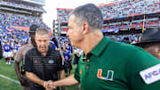 Florida Gators head coach Billy Napier, left shakes hands with Miami Hurricanes head coach Mario Cristobal after the Hurricanes defeated the Gators during the season opener at Ben Hill Griffin Stadium in Gainesville, FL on Saturday, August 31, 2024 against the University of Miami Hurricanes. The Hurricanes defeated the Gators 41-17. [Doug Engle/Gainesville Sun]