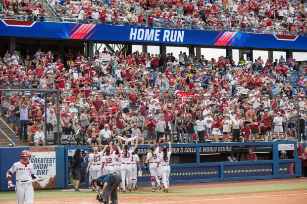Oklahoma celebrates with its fans after beating Duke on Thursday at the WCWS.