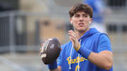 Aug 30, 2025; Pittsburgh, Pennsylvania, USA;  Pittsburgh Panthers quarterback Mason Heintschel (6) warms up before the game against the Duquesne Dukes at Acrisure Stadium. Mandatory Credit: Charles LeClaire-Imagn Images