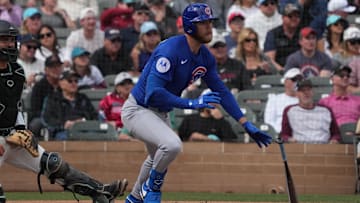 Mar 3, 2025; Salt River Pima-Maricopa, Arizona, USA; Chicago Cubs third base Gage Workman (25) hits an RBI single against the Arizona Diamondbacks in the second inning at Salt River Fields at Talking Stick. Rick Scuteri-Imagn Images