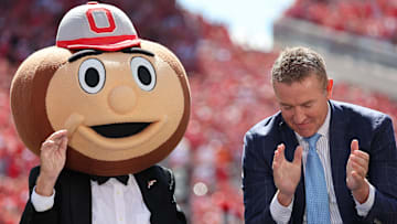 Aug 30, 2025; Columbus, Ohio, USA;  ESPN's College GameDay host, Lee Corso (left) wears the Ohio State mascot costume during a program before the game at Ohio Stadium. Mandatory Credit: Joseph Maiorana-Imagn Images