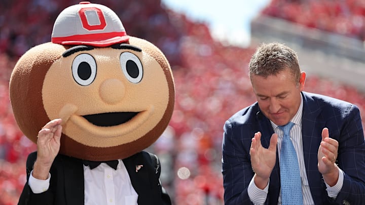 Aug 30, 2025; Columbus, Ohio, USA;  ESPN's College GameDay host, Lee Corso (left) wears the Ohio State mascot costume during a program before the game at Ohio Stadium. Mandatory Credit: Joseph Maiorana-Imagn Images