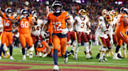 Nov 30, 2025; Landover, Maryland, USA; Denver Broncos running back RJ Harvey (12) celebrates after scoring a touchdown against the Washington Commanders in overtime of the game at Northwest Stadium. Mandatory Credit: Peter Casey-Imagn Images