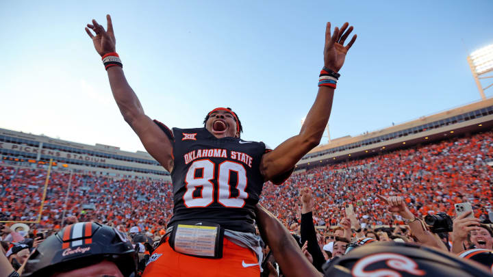 Oklahoma State's Brennan Presley (80) celebrates with teammates following a Bedlam college football game between the Oklahoma State University Cowboys (OSU) and the University of Oklahoma Sooners (OU) at Boone Pickens Stadium in Stillwater, Okla., Saturday, Nov. 4, 2023.