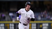 May 7, 2025; Denver, Colorado, USA; Colorado Rockies first base Michael Toglia (4) runs off a two run home run in the third inning against the Detroit Tigers at Coors Field. Mandatory Credit: Ron Chenoy-Imagn Images