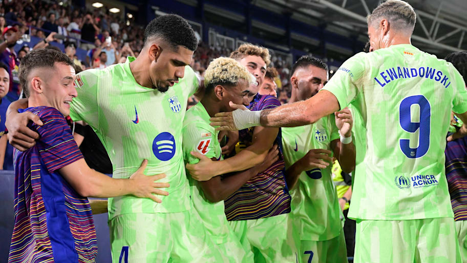 Barcelona players euphorically celebrated their third goal of the night. | JOSE JORDAN/AFP via Getty Images