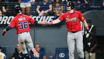 Aug 15, 2025; Cleveland, Ohio, USA; Atlanta Braves pinch runner Eli White (36) celebrates after scoring with catcher Sean Murphy (12) during the ninth inning against the Cleveland Guardians at Progressive Field. Mandatory Credit: Ken Blaze-Imagn Images