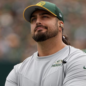 Sep 24, 2023; Green Bay, Wisconsin, USA; Injured Green Bay Packers offensive tackle David Bakhtiari watches his team during the first quarter of their game against the New Orleans Saints at Lambeau Field. Mandatory Credit: Mark Hoffman-USA TODAY Sports