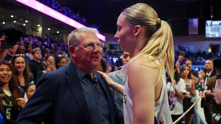 Jun 17, 2025; Arlington, Texas, USA;  University of Connecticut head coach Geno Auriemma speaks with Dallas Wings guard Paige Bueckers (5) after the game against the Golden State Valkyries at College Park Center. Mandatory Credit: Kevin Jairaj-Imagn Images