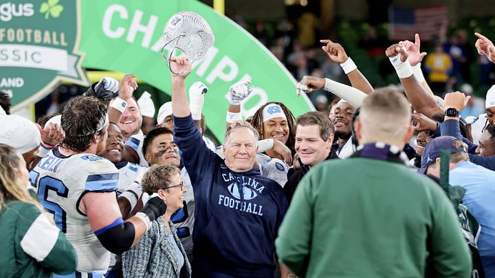Aug 29, 2026; Dublin, Co. Dublin, IRL;  North Carolina Tar Heels head coach Bill Belichick celebrates with the Coach's Award after the game at Aviva Stadium.  Mandatory Credit: Laszlo Geczo-Imagn Images