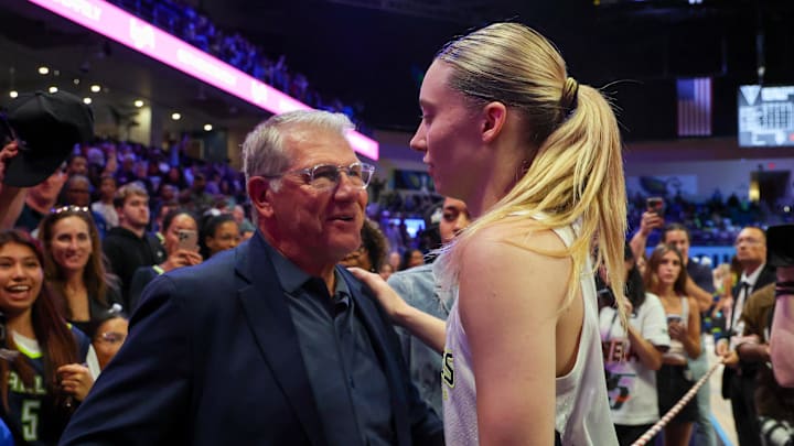 Jun 17, 2025; Arlington, Texas, USA; University of Connecticut head coach Geno Auriemma speaks with Dallas Wings guard Paige Bueckers (5) after the game against the Golden State Valkyries at College Park Center. Mandatory Credit: Kevin Jairaj-Imagn Images Jun 17, 2025; Arlington, Texas, USA; University of Connecticut head coach Geno Auriemma speaks with Dallas Wings guard Paige Bueckers (5) after the game against the Golden State Valkyries at College Park Center. Mandatory Credit: Kevin Jairaj-Imagn Images