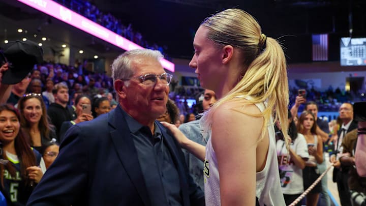 University of Connecticut head coach Auriemma speaks with Dallas Wings guard Bueckers after the game against the Golden State Valkyries at College Park Center. University of Connecticut head coach Auriemma speaks with Dallas Wings guard Bueckers after the game against the Golden State Valkyries at College Park Center.