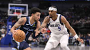 Oct 7, 2024; Dallas, Texas, USA; Memphis Grizzlies guard Scotty Pippen Jr. (1) drives to the basket past Dallas Mavericks guard A.J. Lawson (9) during the second half at the American Airlines Center. Mandatory Credit: Jerome Miron-Imagn Images