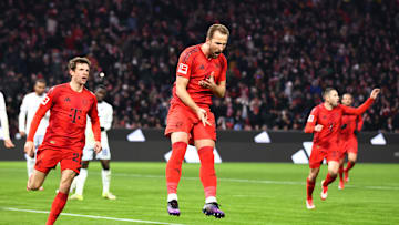 Bayern Munich striker Harry Kane celebrating after scoring against Hoffenheim.