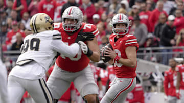 Nov 9, 2024; Columbus, Ohio, USA; Ohio State Buckeyes quarterback Will Howard (18) looks for an open man during the first half  at Ohio Stadium. Mandatory Credit: Barbara Perenic/USA TODAY Network via Imagn Images