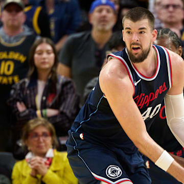 Apr 13, 2025; San Francisco, California, USA; LA Clippers center Ivica Zubac (40) rebounds the ball against the Golden State Warriors during the fourth quarter at Chase Center. Mandatory Credit: Robert Edwards-Imagn Images