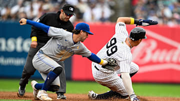 Sep 7, 2025; Bronx, New York, USA; New York Yankees right fielder Aaron Judge (99) slides to steal 2nd base against Toronto Blue Jays third baseman Ernie Clement (22) during the eighth inning at Yankee Stadium. Mandatory Credit: Mark Smith-Imagn Images