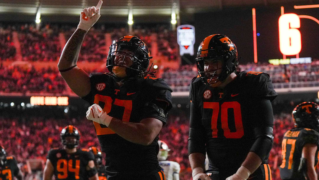 Nov 2, 2024; Knoxville, Tennessee, USA; Tennessee Volunteers running back Peyton Lewis (27) and offensive lineman Andrej Karic (70) celebrate after scoring a touchdown against the Kentucky Wildcats during the first half at Neyland Stadium. Mandatory Credit: Angelina Alcantar/USA TODAY Network via Imagn Images
