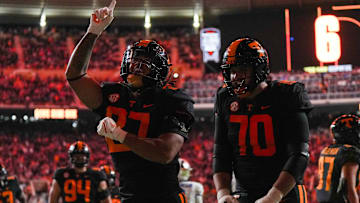 Nov 2, 2024; Knoxville, Tennessee, USA; Tennessee Volunteers running back Peyton Lewis (27) and offensive lineman Andrej Karic (70) celebrate after scoring a touchdown against the Kentucky Wildcats during the first half at Neyland Stadium. Mandatory Credit: Angelina Alcantar/USA TODAY Network via Imagn Images
