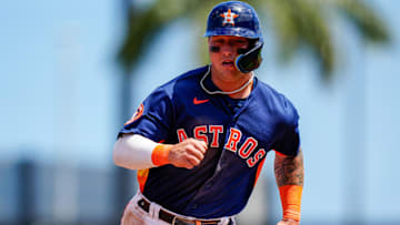 Mar 21, 2023; West Palm Beach, Florida, USA; Houston Astros catcher Korey Lee (11) runs into third base against the Miami Marlins during the third inning at The Ballpark of the Palm Beaches. Mandatory Credit: Rich Storry-Imagn Images