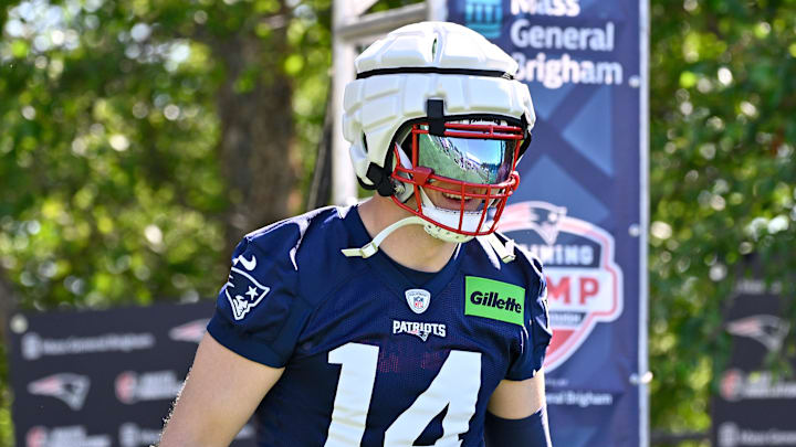 Jul 23, 2025; Foxborough, MA, USA; New England Patriots linebacker Robert Spillane (14) walks to the practice fields for training camp at Gillette Stadium. Mandatory Credit: Eric Canha-Imagn Images