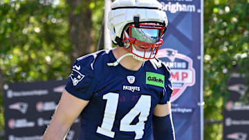 New England Patriots linebacker Robert Spillane (14) walks to the practice fields for training camp at Gillette Stadium.