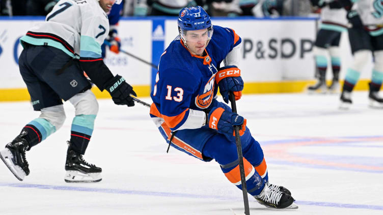 Feb 13, 2024; Elmont, New York, USA; New York Islanders center Mathew Barzal (13) plays the puck in