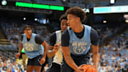 Oct 4, 2025; Charlotte, NC, USA; North Carolina Tar Heels guard Seth Trimble (7) with the ball as guard Jaydon Young (4) defends in the second half at Dean E. Smith Center. 