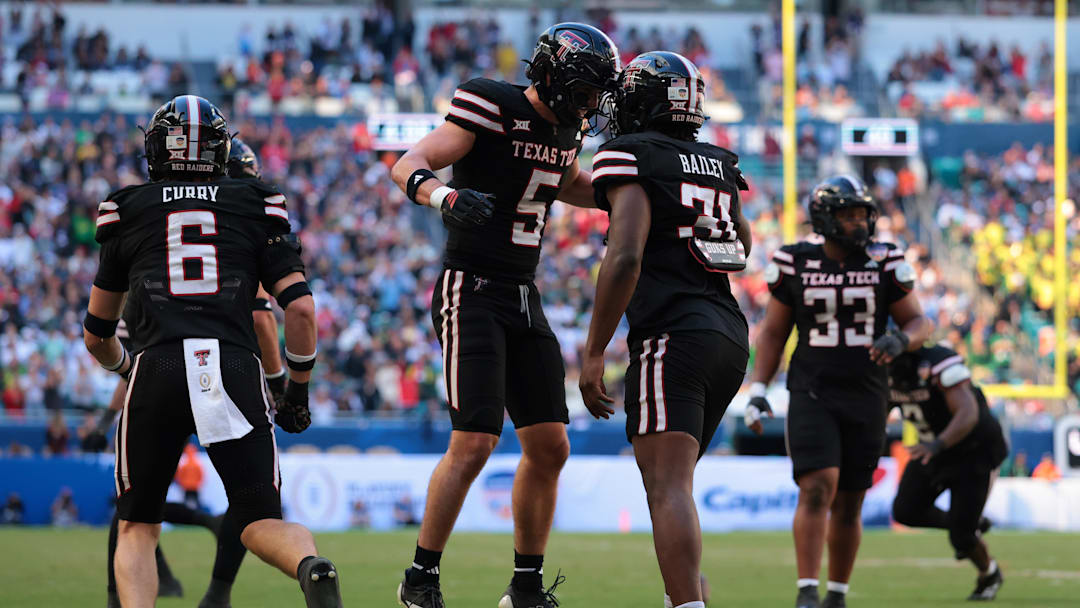 Jan 1, 2026; Miami Gardens, FL, USA; Texas Tech Red Raiders defensive back Cole Wisniewski (5) and linebacker David Bailey (31) react after a defensive play against the Oregon Ducks during the first half of the 2025 Orange Bowl and quarterfinal game of the College Football Playoff at Hard Rock Stadium. Mandatory Credit: Sam Navarro-Imagn Images