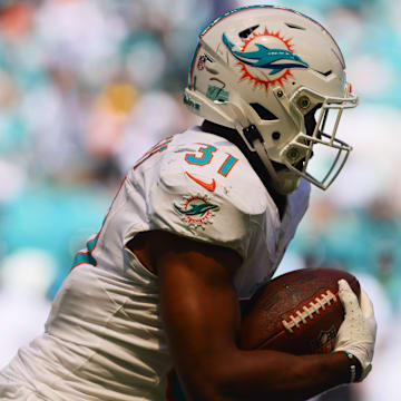 Miami Dolphins running back Raheem Mostert (31) runs with the football against the Jacksonville Jaguars during the third quarter at Hard Rock Stadium in the opener..