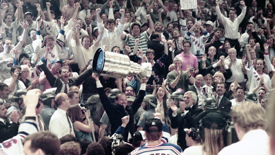 Rangers coach Mike Keenan celebrates with the Stanley Cup after defeating Vancouver 3-2 in Game 7 of the Stanley Cup Final at Madison Square Garden, June 14, 1994.