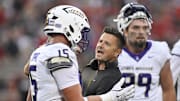 Sep 5, 2025; Louisville, Kentucky, USA;  James Madison Dukes head coach Bob Chesney talks with tight end Lacota Dippre (15) during the first quarter against the Louisville Cardinals at L&N Federal Credit Union Stadium. Mandatory Credit: Jamie Rhodes-Imagn Images