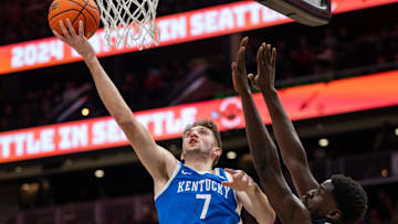 Dec 7, 2024; Seattle, Washington, USA;  Kentucky Wildcats forward Andrew Carr (7) shoots the ball against Gonzaga Bulldogs forward Graham Ike (13) during the second half at Climate Pledge Arena. Mandatory Credit: Stephen Brashear-Imagn Images