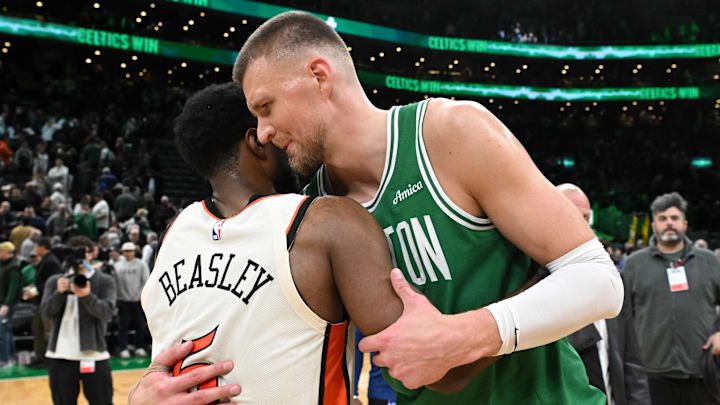 Dec 4, 2024; Boston, Massachusetts, USA; Boston Celtics center Kristaps Porzingis (8) hugs Detroit Pistons guard Malik Beasley (5) after a game at the TD Garden. Mandatory Credit: Brian Fluharty-Imagn Images
