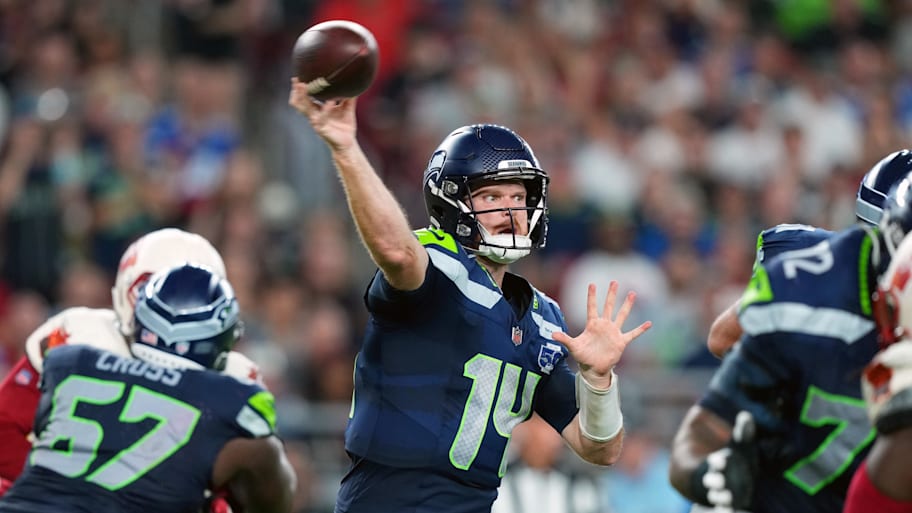 Seattle Seahawks quarterback Sam Darnold (14) throws a pass against the Arizona Cardinals in the third quarter of a game.
