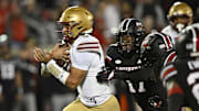 Oct 25, 2025; Louisville, Kentucky, USA;  Boston College Eagles quarterback Grayson James (3) runs the ball against Louisville Cardinals defensive lineman AJ Green (17) during the first quarter at L&N Federal Credit Union Stadium. Mandatory Credit: Jamie Rhodes-Imagn Images